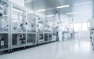 clean room with three employees